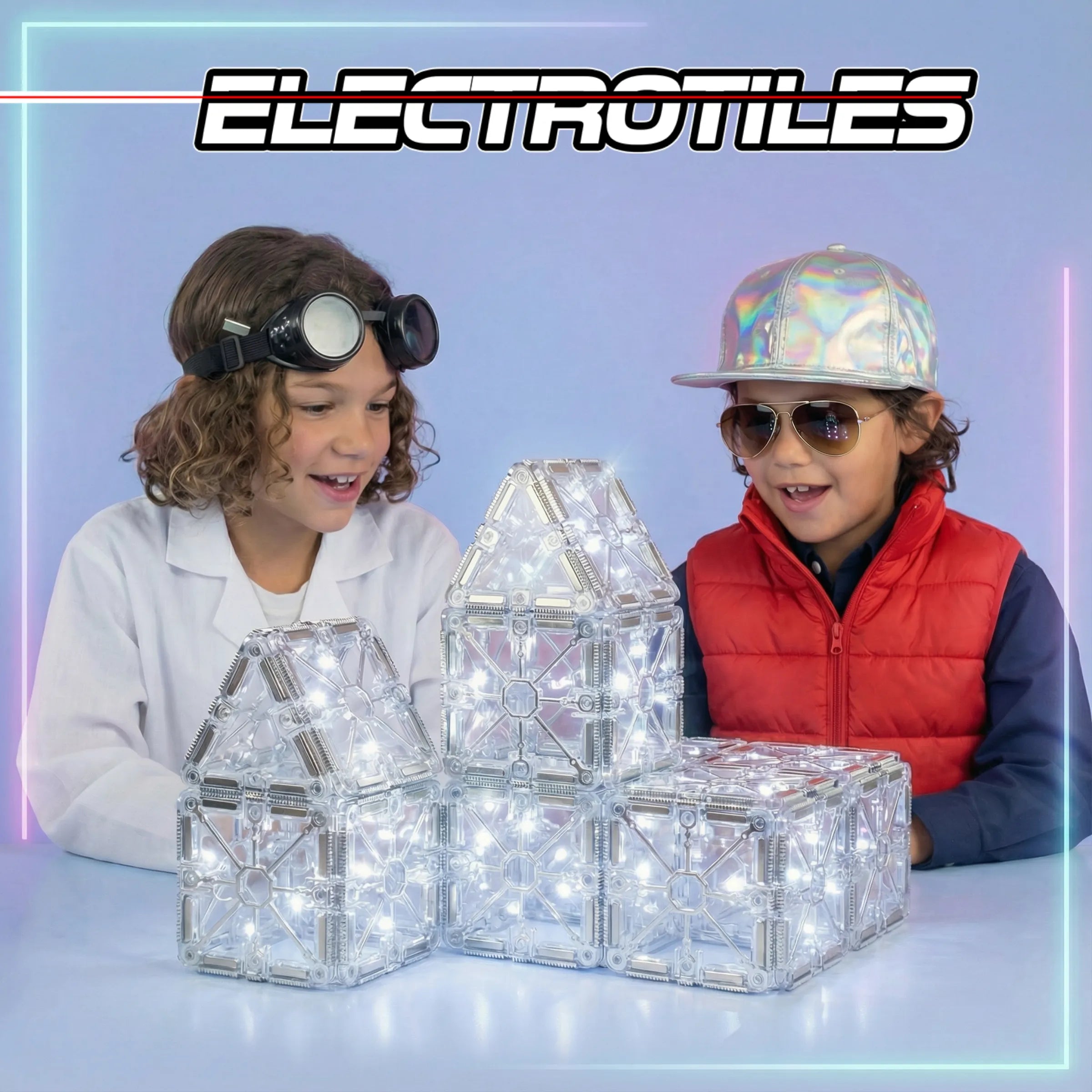 Two kids in lab coats with ELECTROTILES wordmark on gradient background